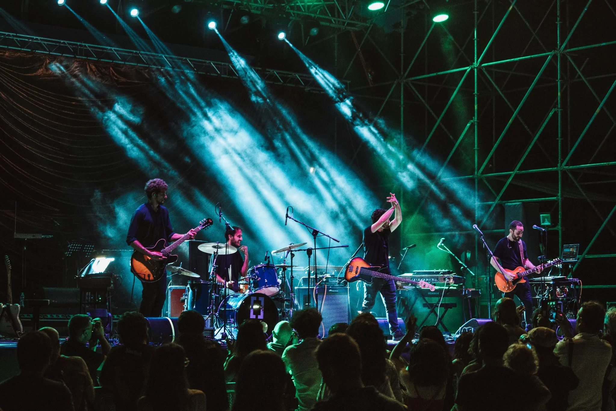 Red Light Skyscraper on stage with lights and crowd