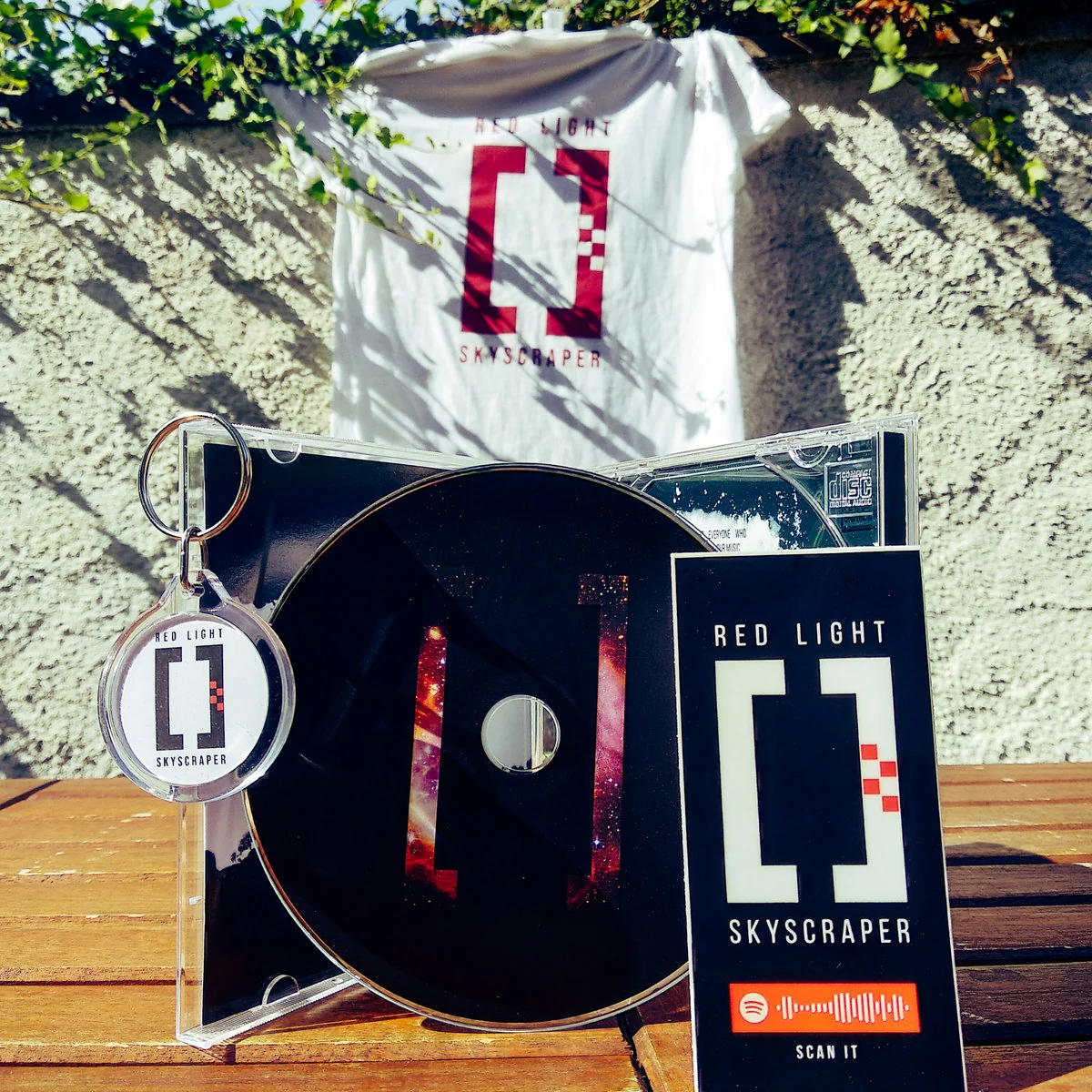 Red Light Skyscraper CD, shirt, keychain and sticker merch